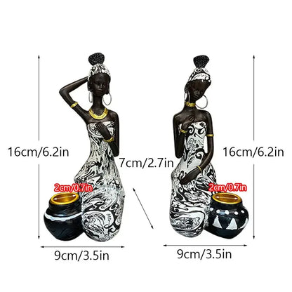 Decorbites black woman candlestick featuring black and white figurines seated beside patterned pots for exotic decor