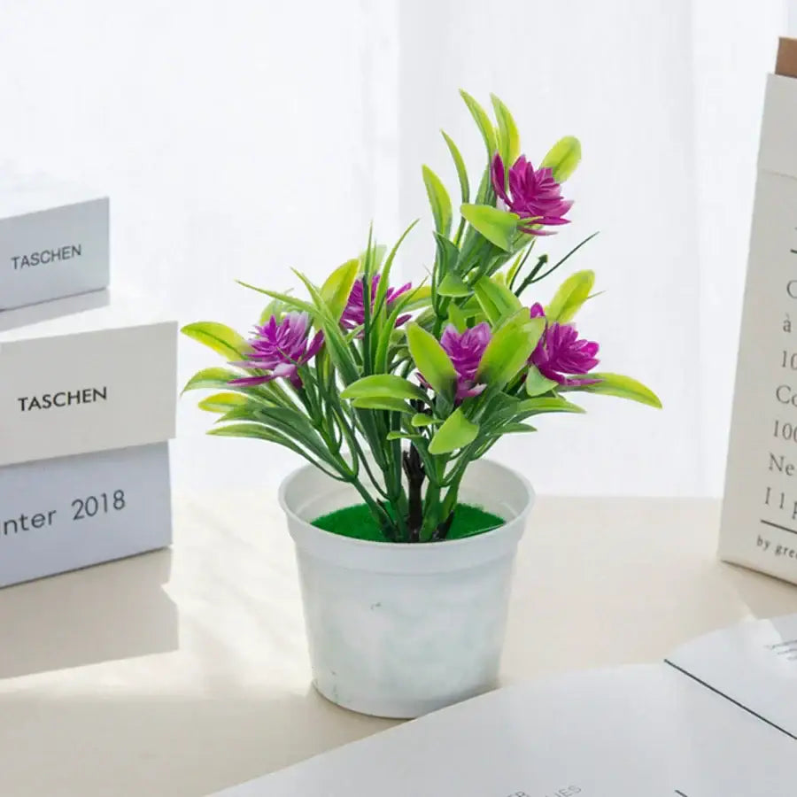 A vibrant artificial flowers bonsai with purple blooms and green leaves in a white plastic vase for decorbites artificial flowers decor