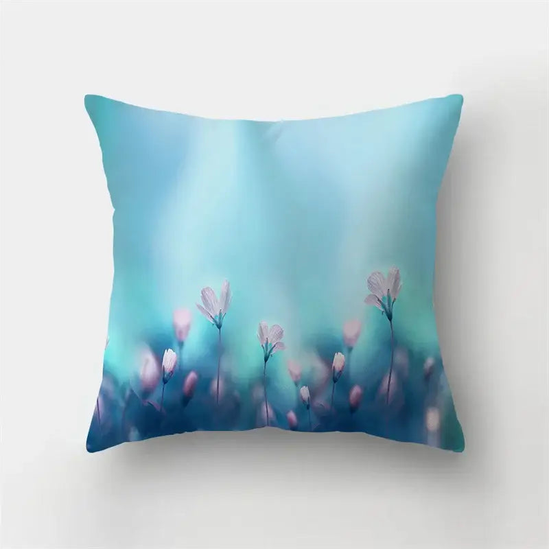 Vibrant butterfly flower pillow case with soft-focus pink flowers on blue gradient background for decorbites flower pillow