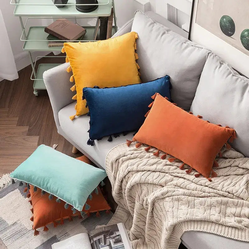 Vibrant fringed tassel velvet throw pillows in yellow blue orange and mint green for living room decorbites tassel velvet decor