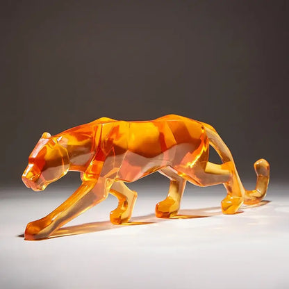 A translucent orange geometric panther figurine with faceted crystalline surfaces for decorbites leopard cheetah decor animal sculptures