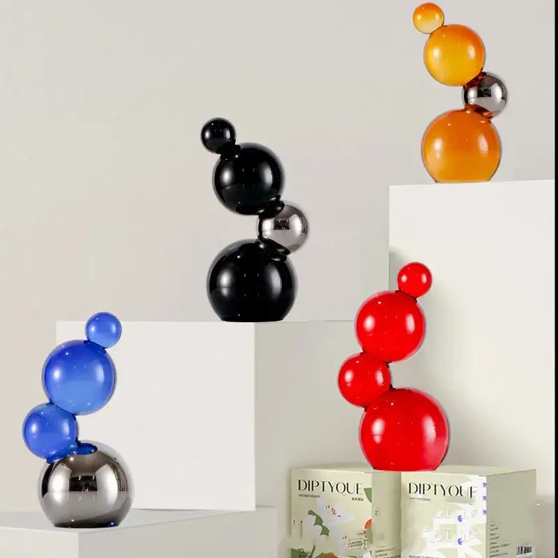 Vibrant glossy crystal bubble decor spheres in red blue black and orange with metallic silver accents for home decor