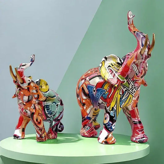 Vibrant graffiti elephant resin sculpture with bold reds yellows and blues glossy finish for living room decorbites decor