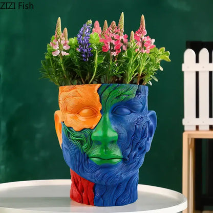 Vibrant human portrait resin vase in orange green blue and red colors with artificial flowers for living room decorbites colorful human decor
