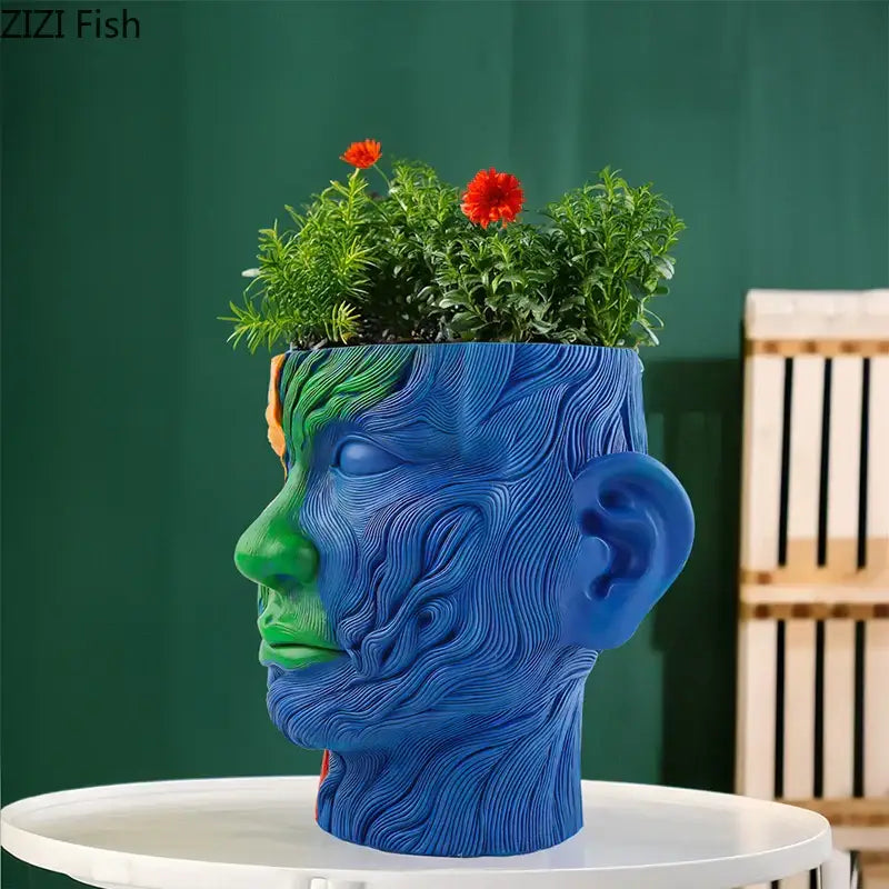 Vibrant human portrait resin vase with swirling blue and green patterns and red artificial flowers for living room decorbites colorful human decor