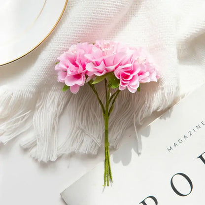 A delicate flower stamen bouquet with pink artificial flower stamens and green stems for living room decor
