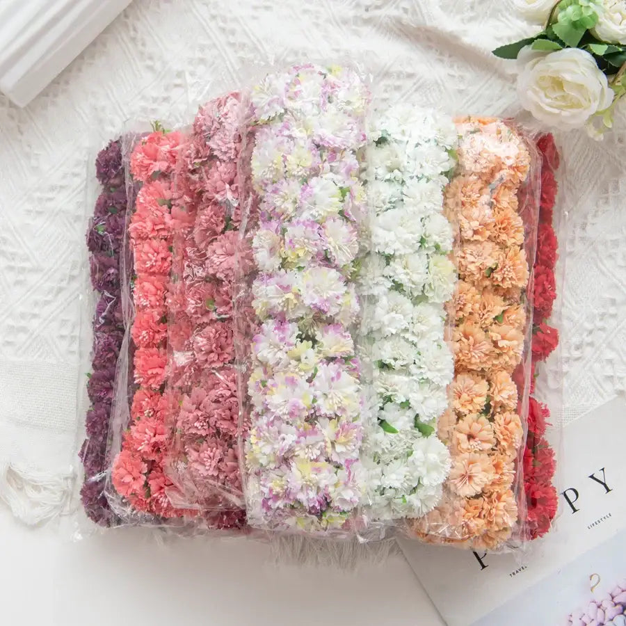 A bundle of vibrant multicolor carnation stamen silk flowers in clear packaging for living room decor by decorbites