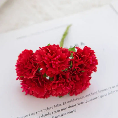 A cluster of vibrant red silk flowers carnation stamen by decorbites for living room decor