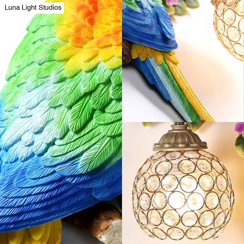 Vibrant parrot wall sconce with rainbow colors led light featuring detailed feather texture and crystal globe shade for bedroom use