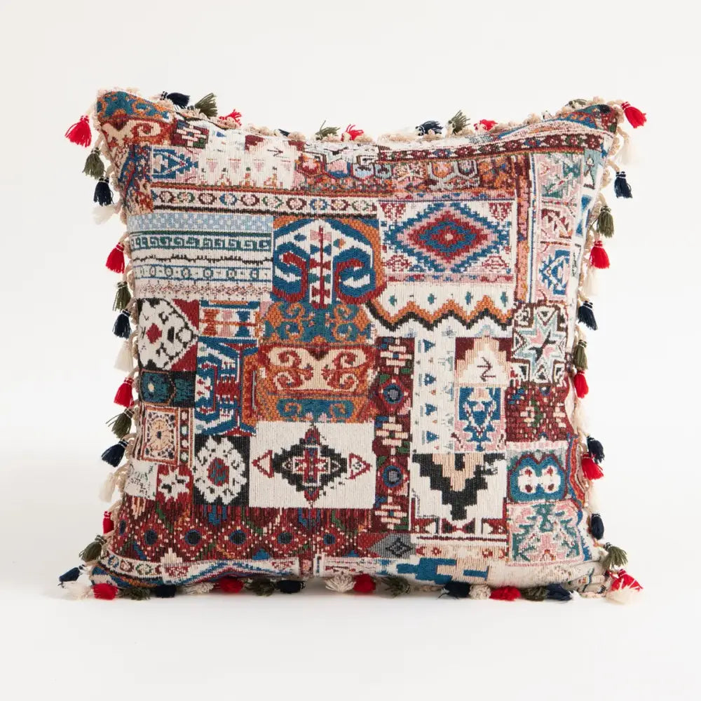 Vibrant patchwork ethnic boho throw pillow covers with red blue beige geometric patterns and multicolored tassels for decorbites decor