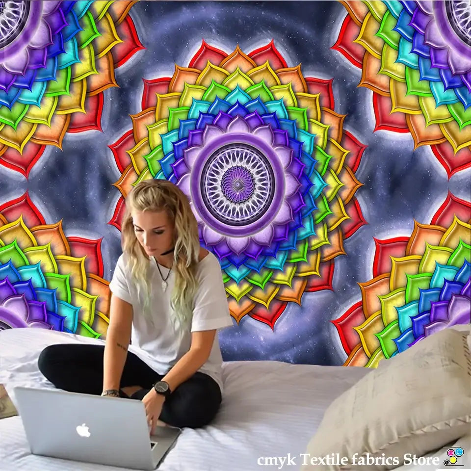 Silver laptop with white apple logo shown beside vibrant pink and purple mandala chakra tapestry bedroom decorbites colorful mandala