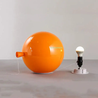Vibrant red orange and yellow balloon lamps wall light featuring a glossy spherical orange lamp with a nozzle detail