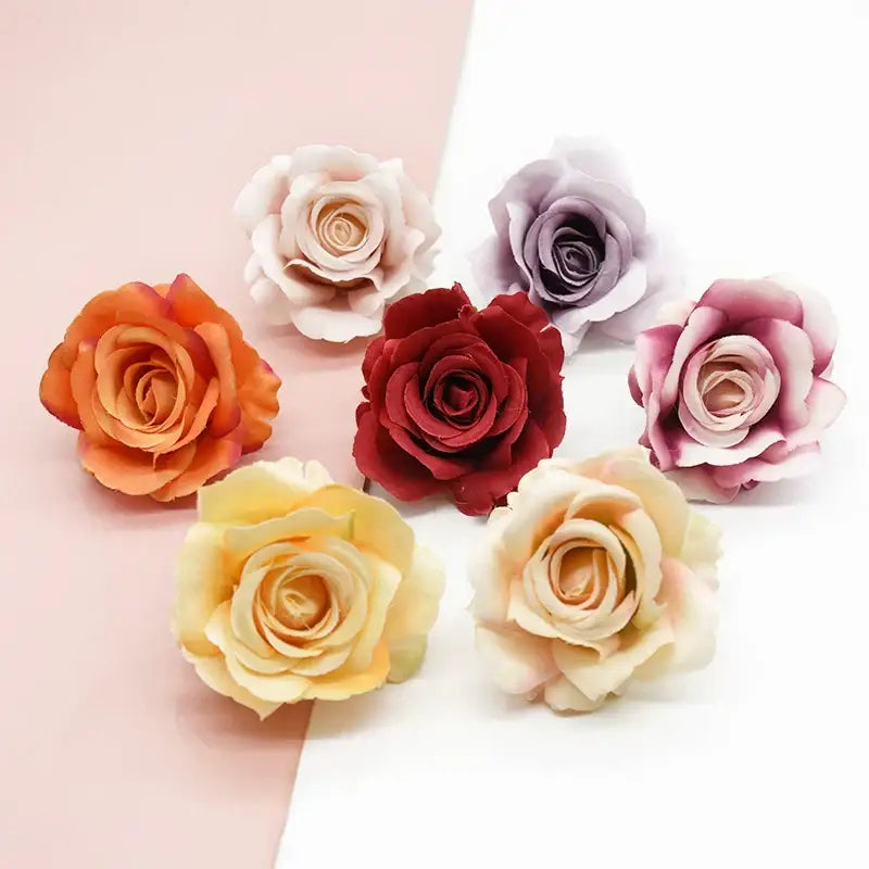 A collection of vibrant decorbites artificial flowers featuring silk artificial roses in orange cream red lavender and pink