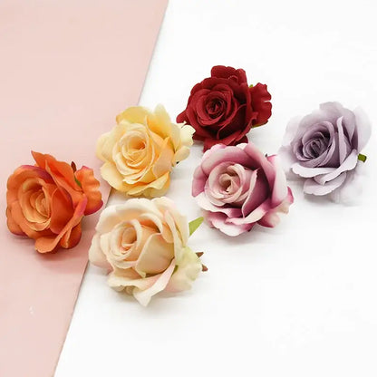 A collection of decorbites artificial silk roses in vibrant red lavender peach and orange for wedding and living room decor