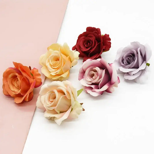 A collection of decorbites artificial silk roses in vibrant red lavender peach and orange for wedding and living room decor