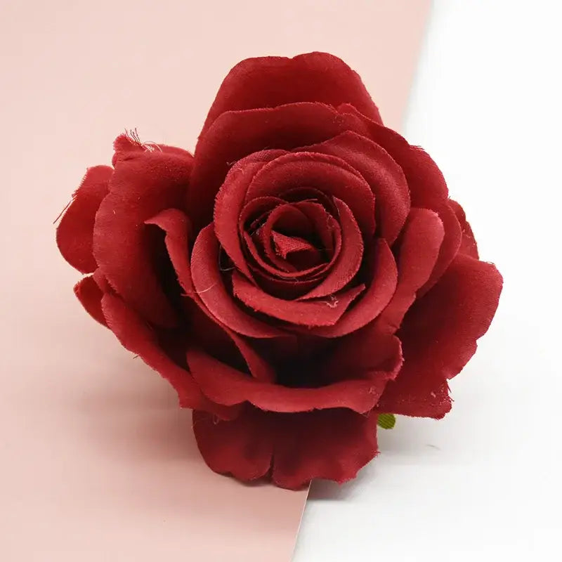 A deep red velvety silk artificial flower with layered petals and green stem for decorbites artificial flowers decor