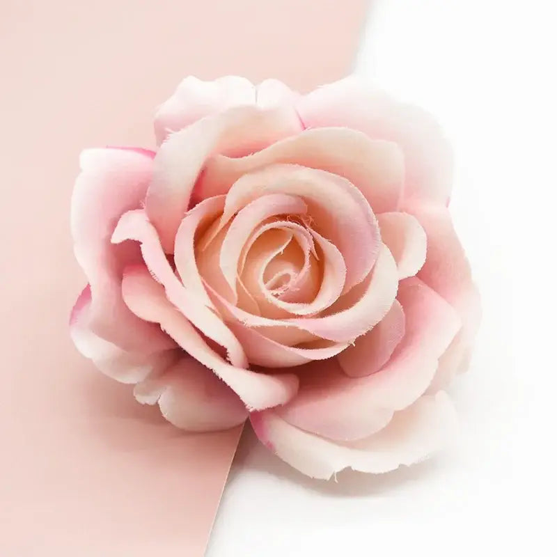 A delicate pink silk artificial rose with layered petals from blush to pale pink for decorbites artificial flowers decor