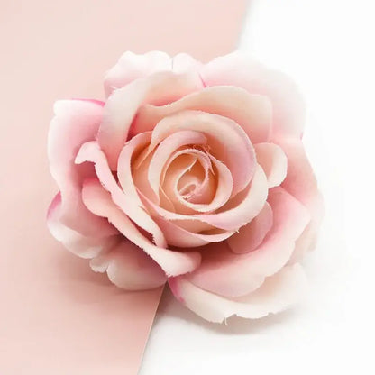 A delicate pink silk artificial rose with layered petals from blush to pale pink for decorbites artificial flowers decor
