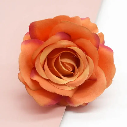 A vibrant orange and soft pink silk artificial flower rose from decorbites artificial flowers for wedding and living room decor