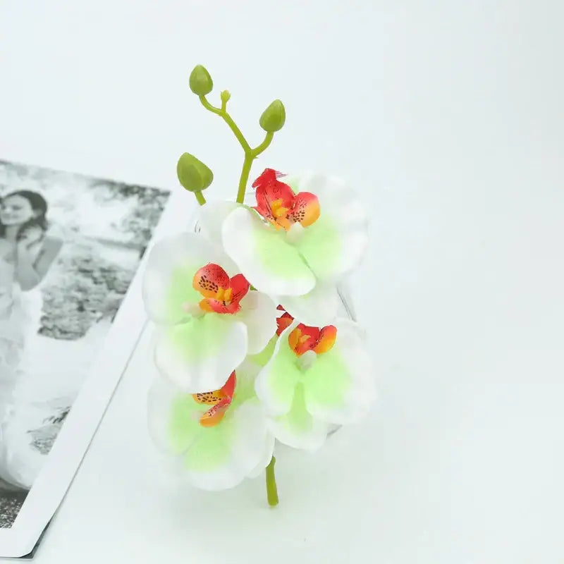 Vibrant silk butterfly orchid bouquet with white petals green stems and red-orange centers for wedding and home decor