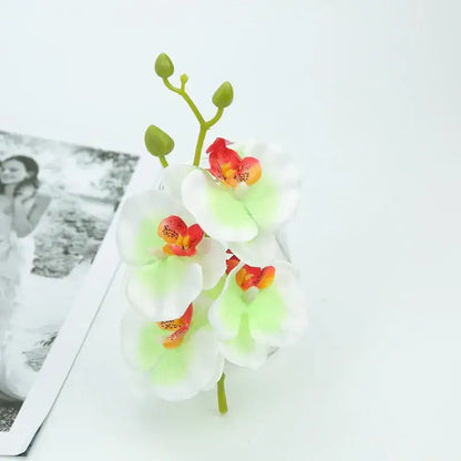 Vibrant silk butterfly orchid bouquet with white petals green stems and red-orange centers for wedding and home decor