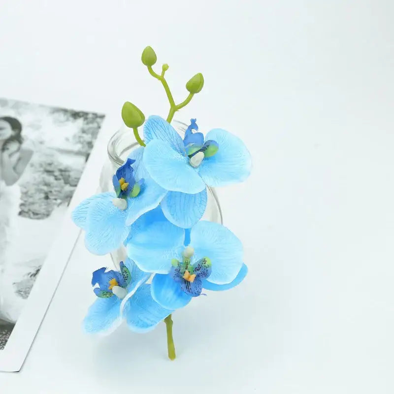 Delicate blue butterfly orchid bouquet with green synthetic stems and buds for wedding and home decor