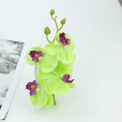 Vibrant silk butterfly orchid bouquet featuring lime green butterfly orchids with purple centers and yellow stamens