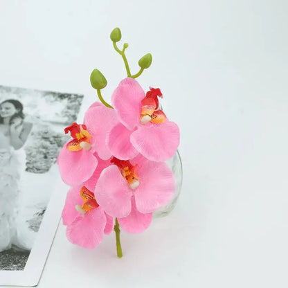 Pink vibrant silk butterfly orchid bouquet with delicate petals and green stems for wedding and home decor