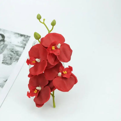 Vibrant silk butterfly orchid bouquet featuring red artificial petals with yellow centers for wedding and home decor