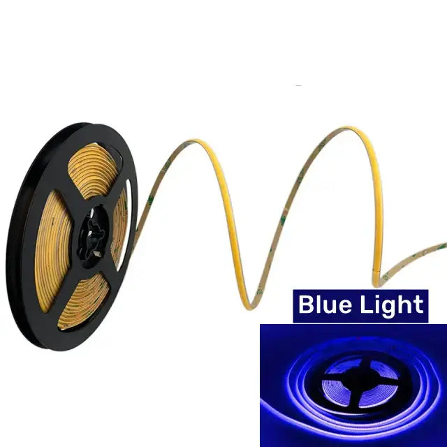 Vibrant slim 4mm cob led strip lights emitting blue light on a black spool with flexible yellowish gold adhesive backing