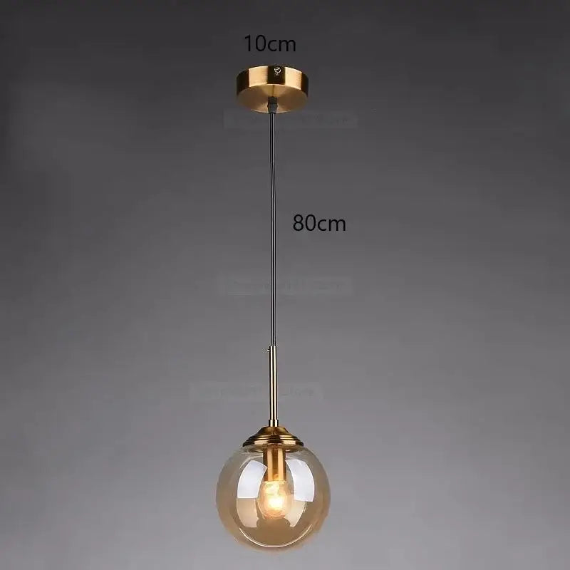 A modern pendant light with a spherical amber glass globe and brass hardware for bedroom decorbites gray glass ball lighting