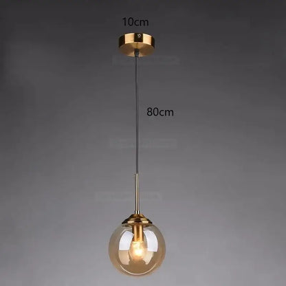 A modern pendant light with a spherical amber glass globe and brass hardware for bedroom decorbites gray glass ball lighting