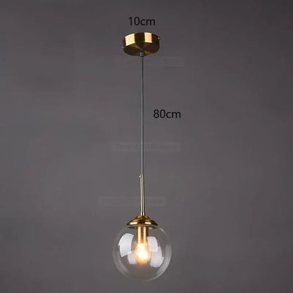A modern pendant light with clear gray glass ball, brass hardware, and 80cm length for decorbites gray glass decor