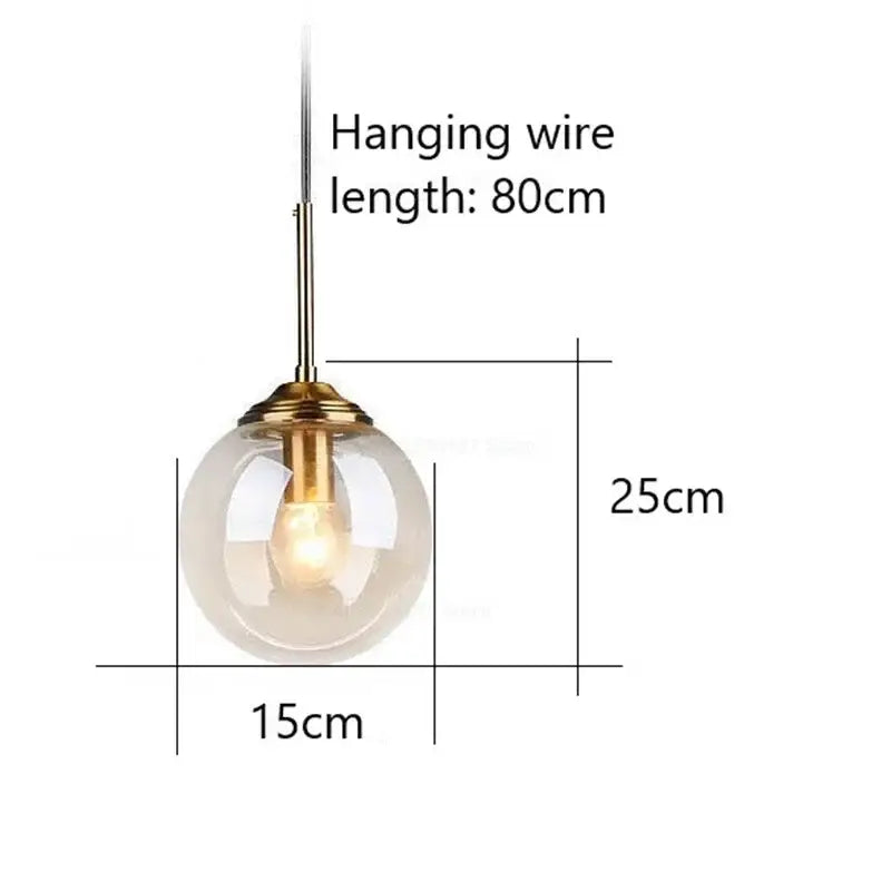 A modern gray glass ball pendant light with frosted globe and brass hardware ideal for bedroom decorbites pendant lights