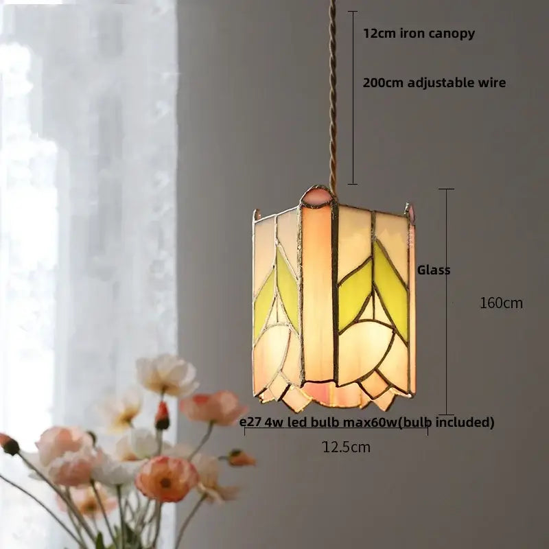 Vintage amber and cream stained glass pendant lamp with geometric leaf pattern and decorbites copper knob switch