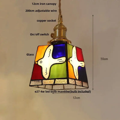Vintage amber and cream stained glass pendant lamp with colorful bird design and decorbites copper knob switch