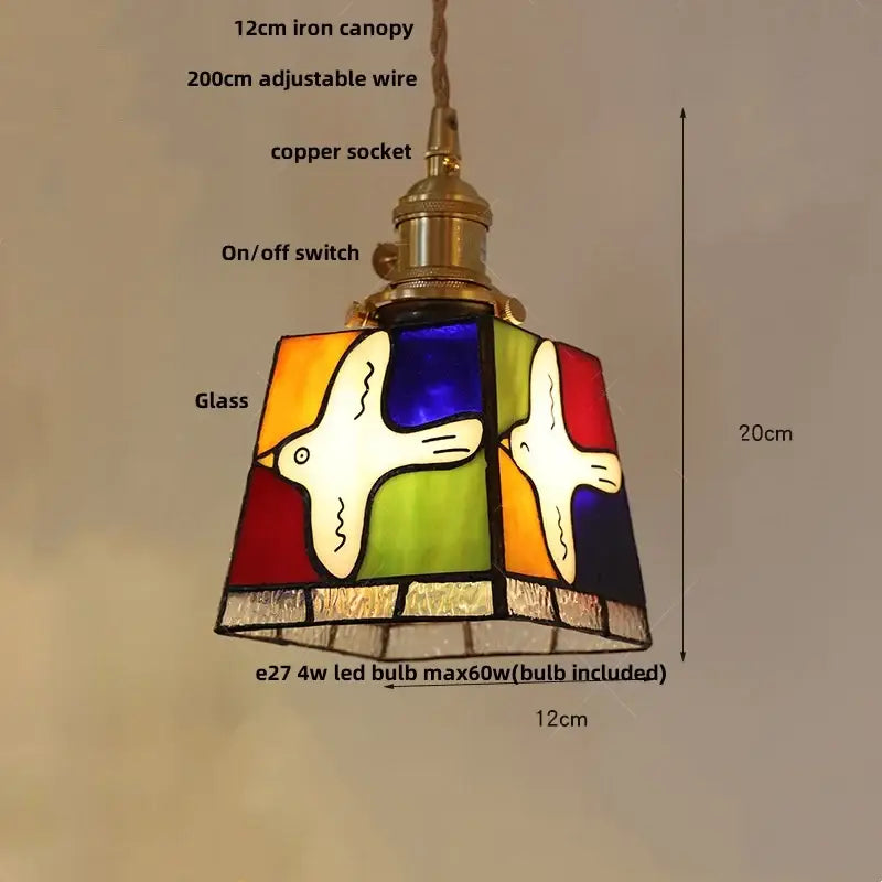 Vintage amber and cream stained glass pendant lamp with colorful bird design and decorbites copper knob switch