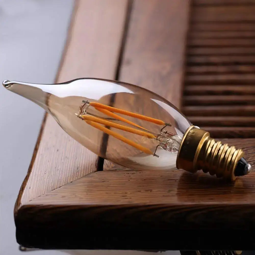 A vintage amber dimmable led filament bulb with clear glass and brass base for decorbites dimmable led pendant light