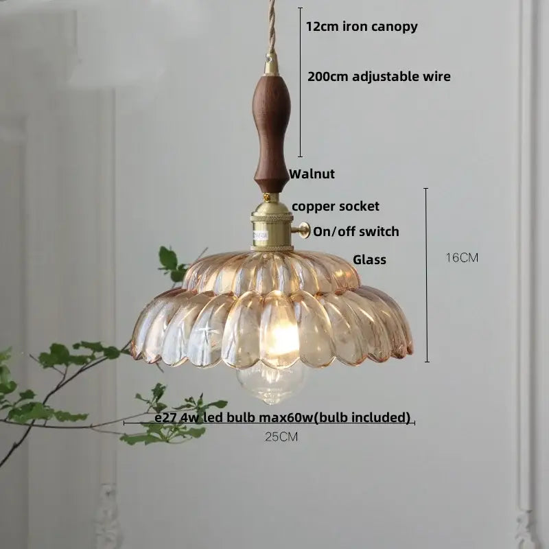 Vintage amber flower glass pendant lamp with warm-toned petals, walnut wooden canopy, and brass hardware for dining room