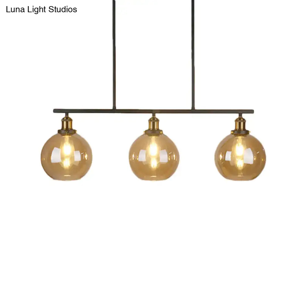 Decorbites™ vintage amber glass island pendant with three amber glass globe cones and brass accents for 220v-240v use