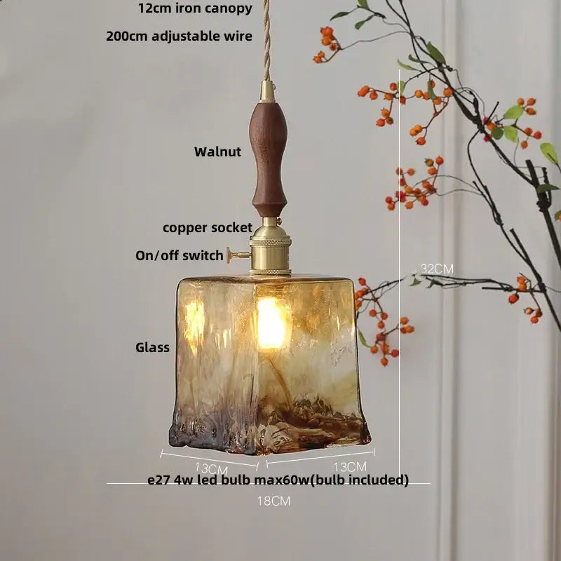 A vintage amber glass adjustable led pendant light with textured hand blown finish and walnut wooden handle for dining room