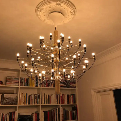 A golden multi-armed chandelier with vintage amber glass led filament bulbs and black cords for bedroom dimmable decorbites lighting