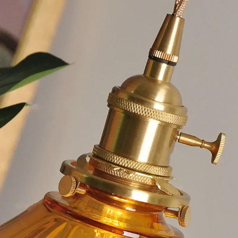 Vintage amber glass led pendant light with brass-finished industrial knurled design for kitchen decorbites amber glass decor