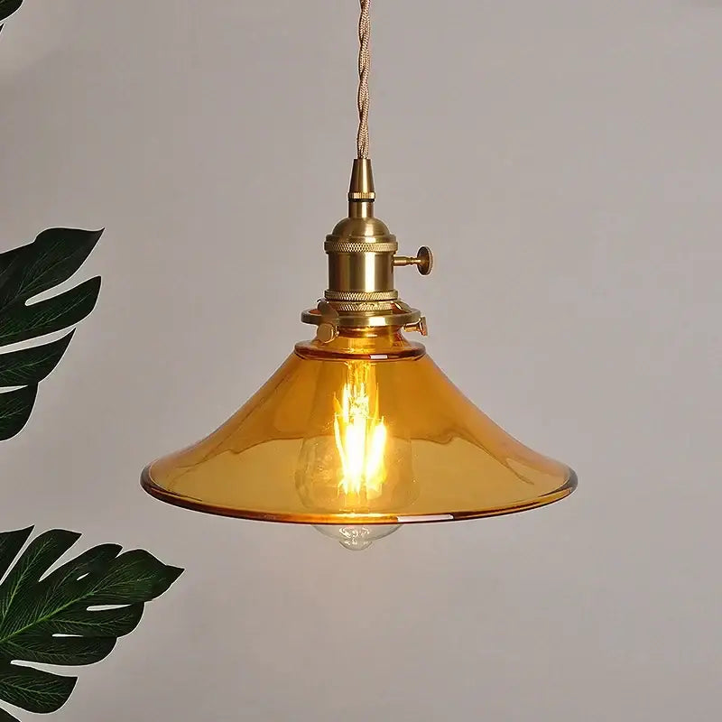 Vintage amber glass led pendant light with decorbites amber glass, brass industrial fixture, and twisted cord for kitchen decor