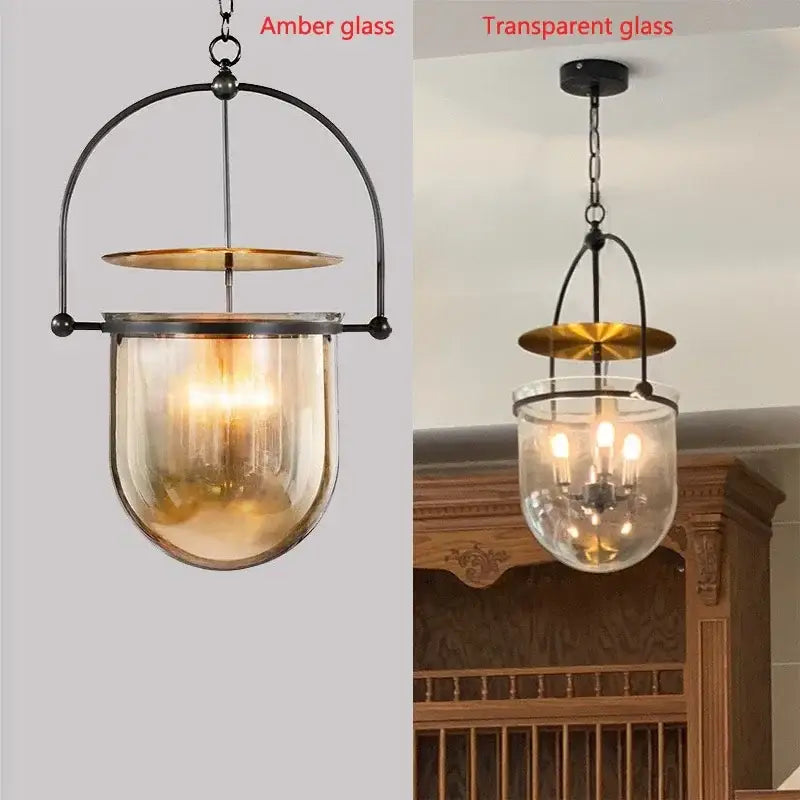 Vintage amber glass pendant light with brass accent and arched black metal frame for dining room use