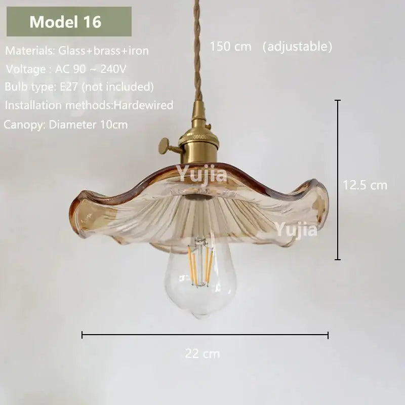 Vintage amber glass pendant light with ruffled edges and brass hardware for kitchen island lighting