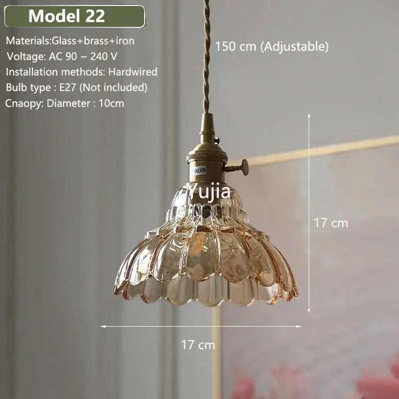 Vintage amber glass pendant light with clear faceted shade and brass hardware for kitchen island lighting