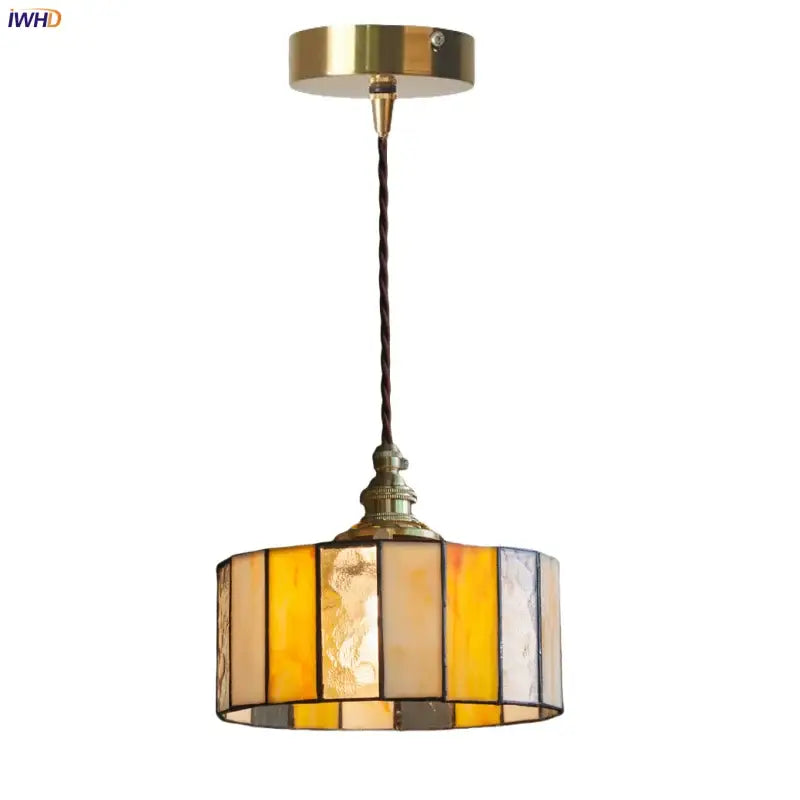 Vintage amber stained glass pendant light with brass mount and twisted cord featuring decorbites colorful led design