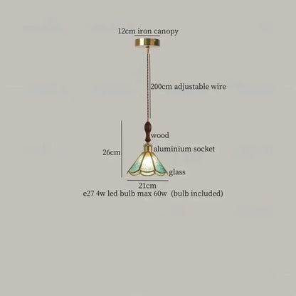 A tiffany-style pendant light with translucent green glass shade, brass canopy, wood and aluminum by decorbites colorful led