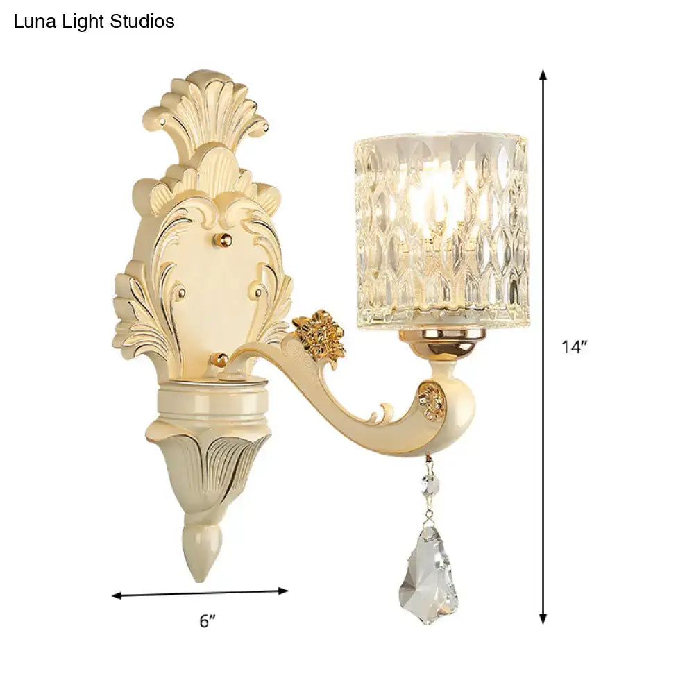 Cream-colored vintage glass wall light with gold leaf base and faceted crystal glass shade for bedroom use